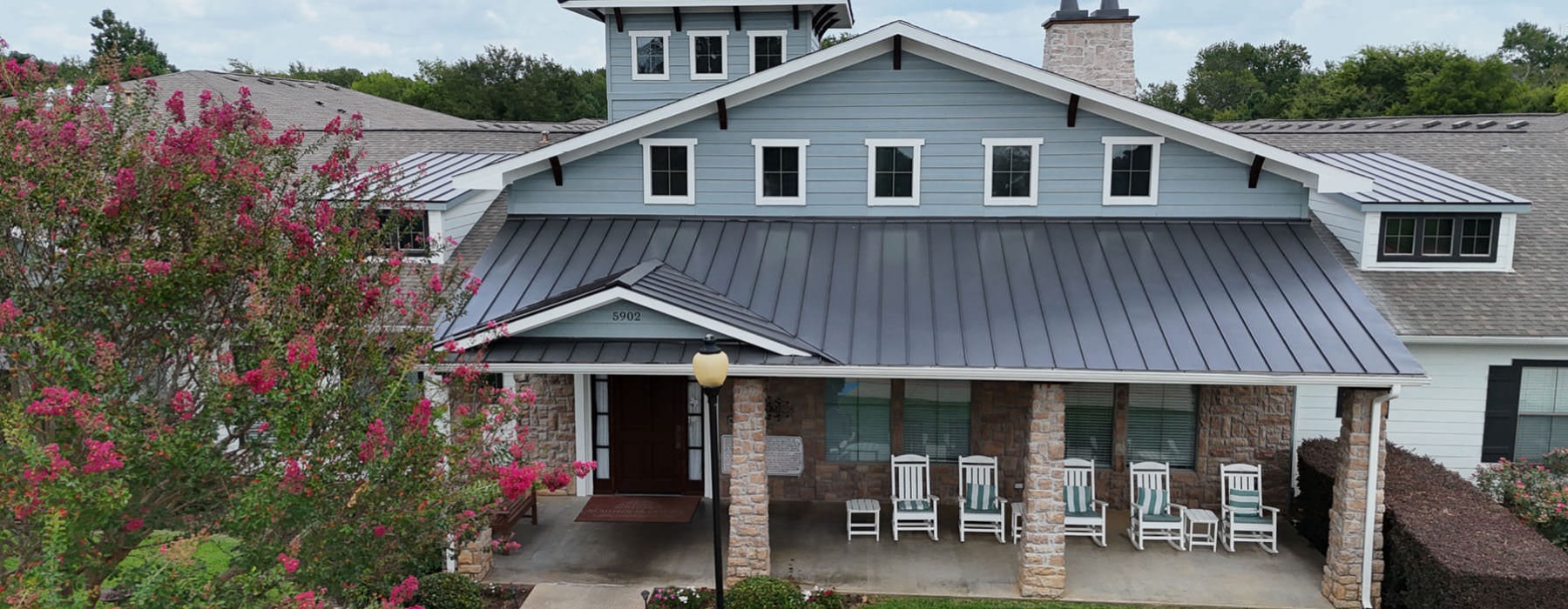 rocking chairs on leasing office porch