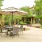 a patio with umbrella shaded table and chairs